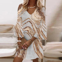 Kleid mit zeitlosem Muster – Gold