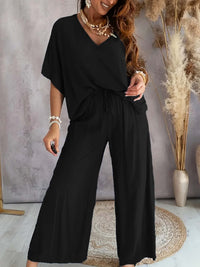 Damen Lässiges Freizeitoutfit bestehend aus lockerem Oberteil und weiten Hosen – Schwarz